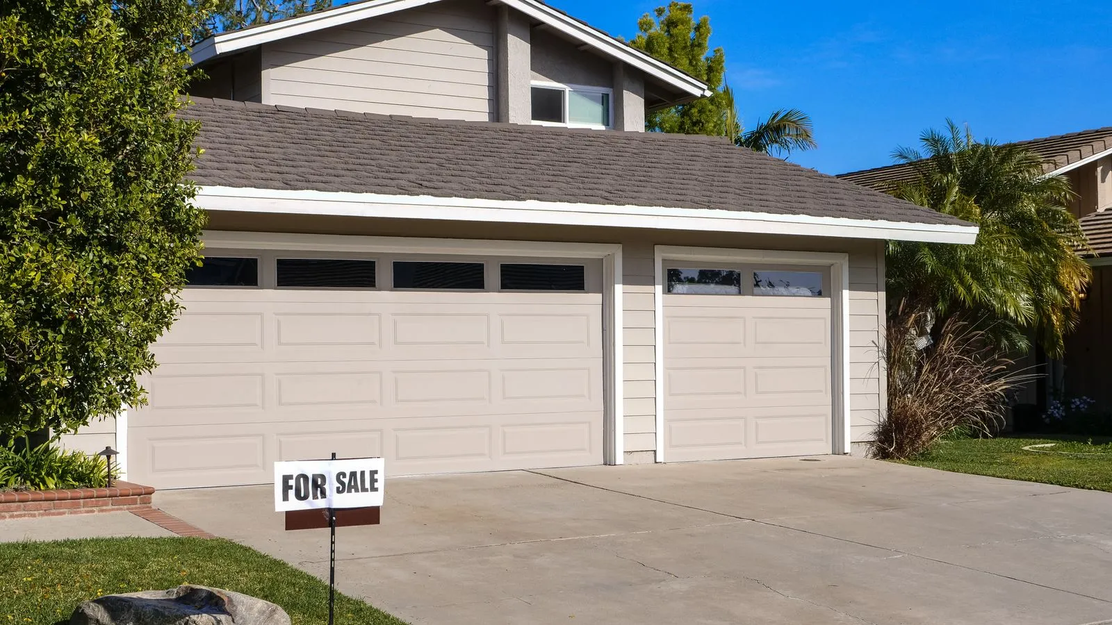 The exterior of a single-family American house with a front lawn